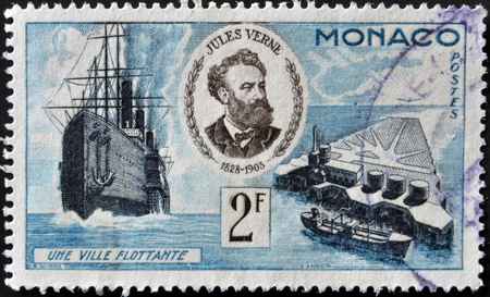 MONACO - CIRCA 1955: A stamp printed in Monaco shows portrait of Jules Verne, series devoted to his books, circa 1955 のeditorial素材