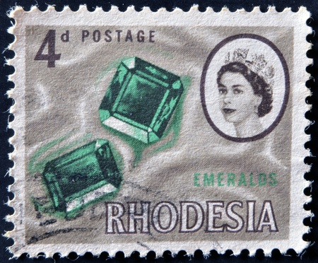 RHODESIA - CIRCA 1964: A stamp printed in Rhodesia shows emeralds, circa 1964のeditorial素材