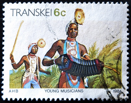 REPUBLIC OF SOUTH AFRICA - CIRCA 1984: A stamp printed in Transkei shows young musicians, circa 1984 のeditorial素材