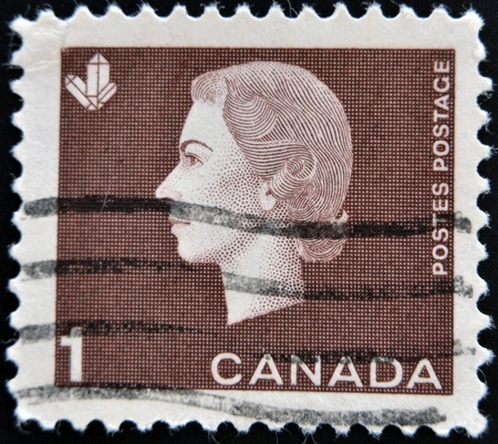 CANADA - CIRCA 1963: A stamp printed in Canada shows Queen Elizabeth II and thethe sign of wheat , circa1963 のeditorial素材
