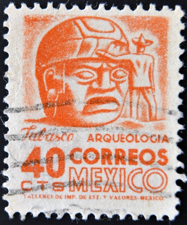 MEXICO - CIRCA 1951  A stamp printed in the Mexico, shows a giant stone head Olmec, La Venta, circa 1951 のeditorial素材