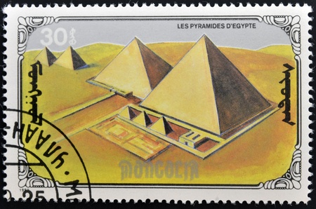 MONGOLIA - CIRCA 1990  A stamp printed in mongolia shows the pyramids of Egypt, circa 1990のeditorial素材