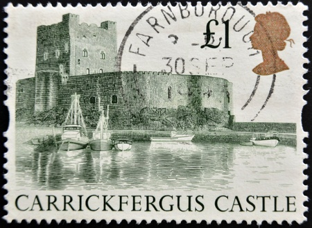 UNITED KINGDOM - CIRCA 1988  a stamp printed in the Great Britain shows Carrickfergus Castle, circa 1988のeditorial素材