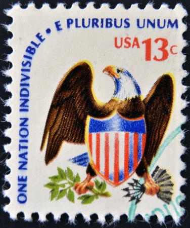 USA - CIRCA 1975  A stamp printed in USA from the  Americana  issue showing an eagle and shield and the inscription  One Nation Indivisible-E Pluribus Unum , circa 1975  のeditorial素材