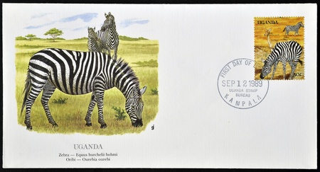 UGANDA - CIRCA 1989: A stamp printed in Uganda shows Zebra and Oribi, circa 1989のeditorial素材