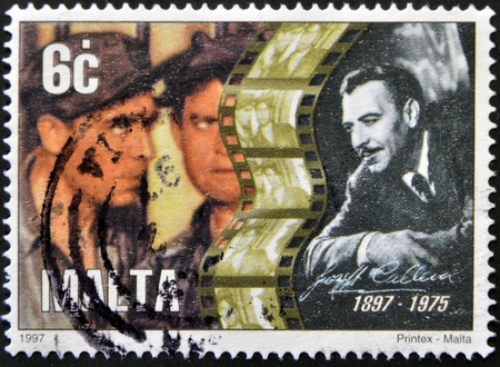 MALTA - CIRCA 1997: A stamp printed in Malta shows Joseph Calleia, circa 1997のeditorial素材