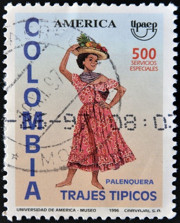 COLOMBIA - CIRCA 1996  A stamp printed in Colombia dedicated to tradittional dress, shows palenquera, circa 1996の写真素材