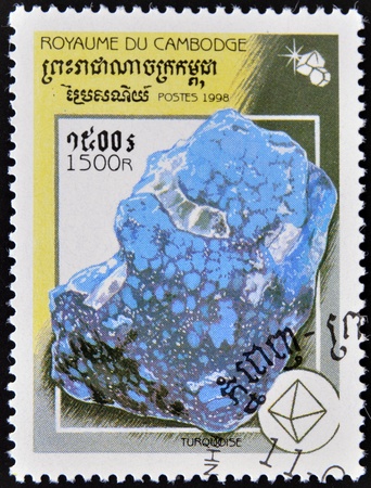 CAMBODIA - CIRCA 1998: A stamp printed in Cambodia shows a Turquoise, circa 1998 の写真素材