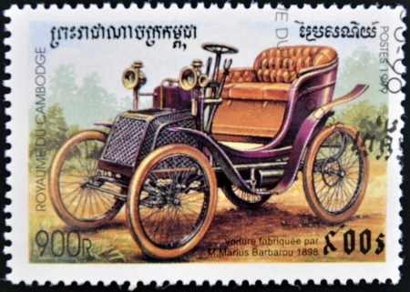 CAMBODIA - CIRCA 1999: stamp printed in Cambodia, shows retro car, circa 1999. の写真素材