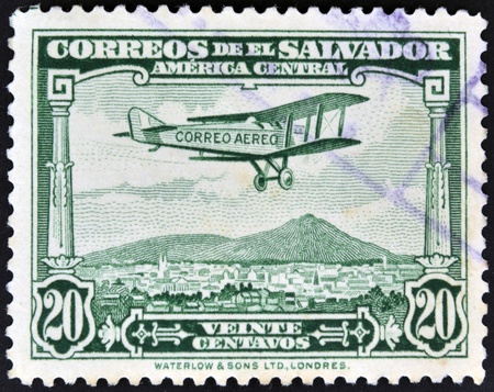 EL SALVADOR - CIRCA 1940: A stamp printed in el Salvador shows plane flying over El Salvador, circa 1940の写真素材