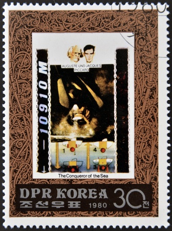DEMOCRATIC PEOPLE'S REPUBLIC (DPR) of KOREA - CIRCA 1980: A stamp printed in North Korea shows Auguste and Jacques Piccard, one stamp from series The Conqueror of sea, circa 1980 のeditorial素材