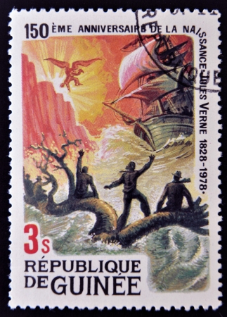 GUINEA - CIRCA 1979: A stamp printed in Guinea shows Jules Verne story, Children of Captain Grant, circa 1979 のeditorial素材