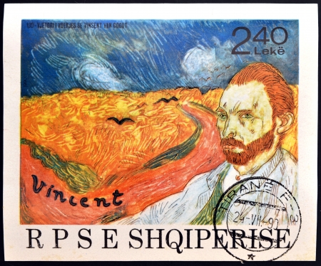 ALBANIA - CIRCA 1990: A stamp printed in Albania shows the work: Wheatfield with Crows and self-portrait of Vincent Van Gogh, circa 1990のeditorial素材