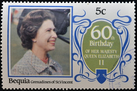 BEQUIA - CIRCA 1986: A stamp printed in Grenadines of St. Vincent celebrating 60th birthday of her majesty Queen Elizabeth II, circa 1986のeditorial素材