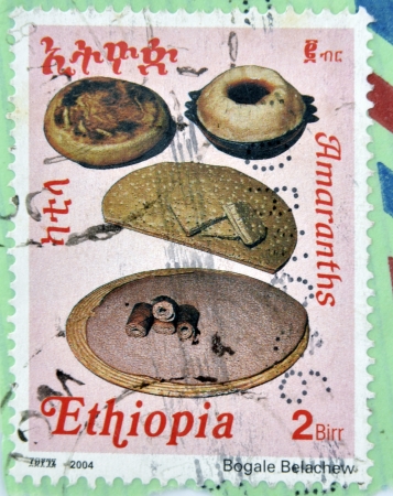 ETHIOPIA - CIRCA 2004 : A stamp printed in Ethiopia shows four types of traditional bread of Ethiopia, circa 2004の写真素材