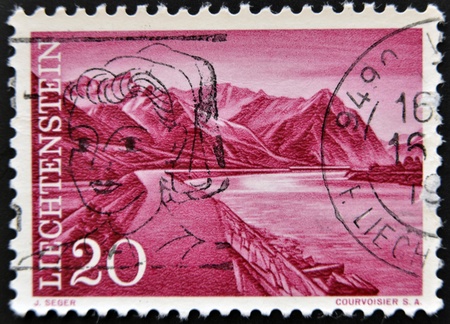 LIECHTENSTEIN - CIRCA 1959: A stamp printed in  Liechtenstein, shows a Mountain landscape from Lake Constance, circa 1959 のeditorial素材