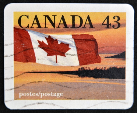 CANADA - CIRCA 1989: stamp printed in Canada shows Flag and Landscape, circa 1989 の写真素材