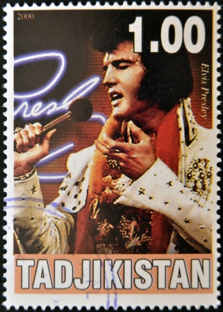 TAJIKISTAN - CIRCA 2000: A stamp printed in Tajikistan shows Elvis Presley, circa 2000 のeditorial素材