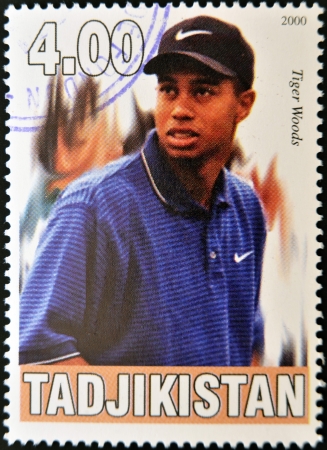 TAJIKISTAN - CIRCA 2000: A stamp printed in Tajikistan shows Tiger Woods, circa 2000 のeditorial素材