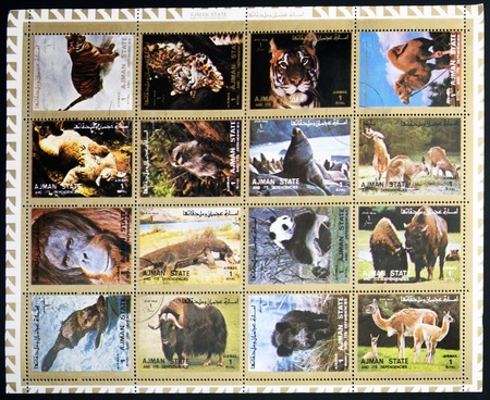 AJMAN- CIRCA 1972: A collection of sixteen stamps showing pictures of endangered animals, circa 1972 のeditorial素材