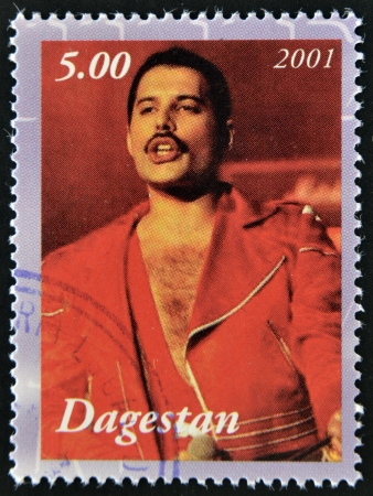 DAGESTAN - CIRCA 2001: A stamp printed in Republic of Dagestan shows Freddie Mercury leader the Queen, 1980s famous musical pop group, circa 2001のeditorial素材