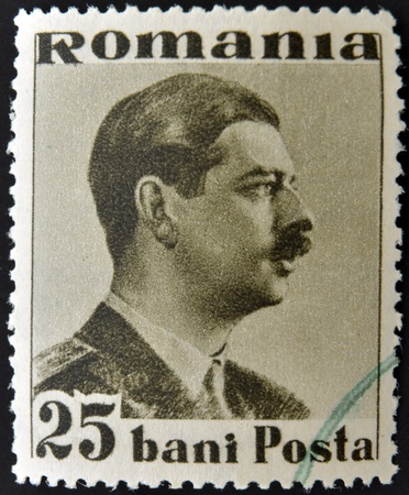 ROMANIA - CIRCA 1930: stamp printed in Romania show King Carol, circa 1930のeditorial素材