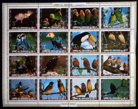 UMM AL QIWAIN - CIRCA 1973: Collection stamps printed in Umm al Qiwain shows Parrots, circa 1973 のeditorial素材