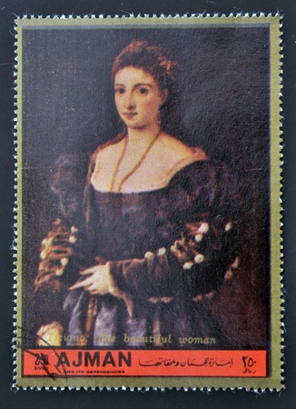 AJMAN - CIRCA 1972: A stamp printed in Ajman  Christmas collection, peace in the world,shows portrait of the beautiful woman by Titian, circa 1972 のeditorial素材