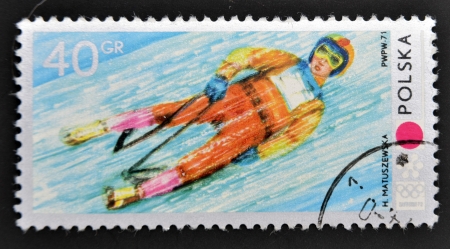 POLAND - CIRCA 1971: A stamp printed in Poland shows Toboggan, circa 1971のeditorial素材