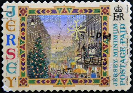 JERSEY - CIRCA 2004: A stamp printed in Jersey shows Street with Christmas decorations, circa 2004 の写真素材