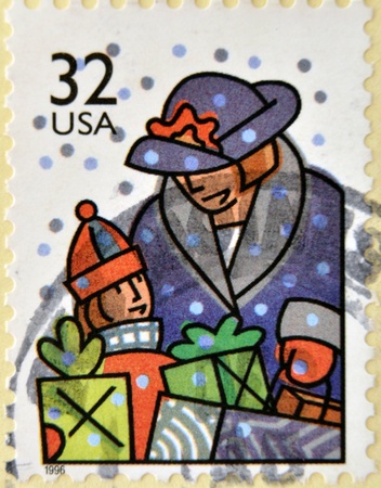 UNITED STATES OF AMERICA - CIRCA 1996: A stamp printed in USA dedicated to Christmas shows holiday shopping, circa 1996の写真素材