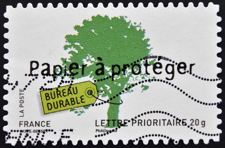 FRANCE - CIRCA 2008: A stamp printed in France dedicated to sustainable ideas, shows Paper to protect, circa 2008 のeditorial素材