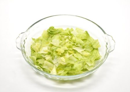 chopped lettuce on glass bowlの写真素材