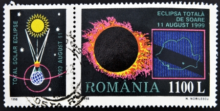 ROMANIA - CIRCA 1998: A stamp printed in Romania shows Total Eclipse of the Sun, circa 1998 のeditorial素材