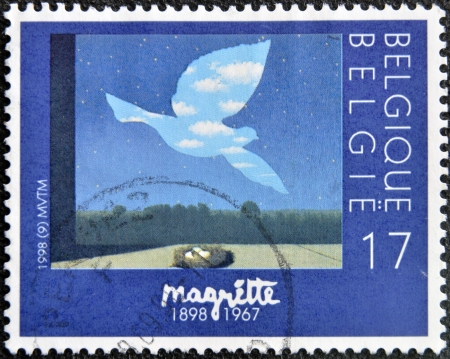 BELGIUM - CIRCA 1998: A stamp printed in Belgium shows the painting "Le retour" by Magritte, circa 1998 の写真素材