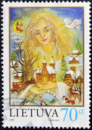 LITHUANIA - CIRCA 1998: A stamp printed in Lithuania shows symbolic image of Christmas, circa 1998のeditorial素材