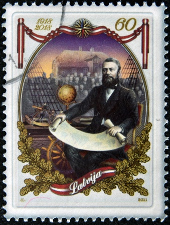 LATVIA - CIRCA 2011: A  stamp printed in Latvia dedicated to The first Naval School of Latvia, circa 2011のeditorial素材