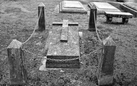old stone grave with a crossのeditorial素材