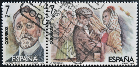 SPAIN-CIRCA 1984:Two stamps printed in Spain shows the portrait of Roberto Chapi composer and a scene of the operetta " la Revoltosa", circa 1984. のeditorial素材