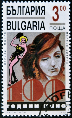 BULGARIA - CIRCA 1995: A stamp printed in Bulgaria shows Marlene Dietrich and Marilyn Monroe, circa 1995 のeditorial素材