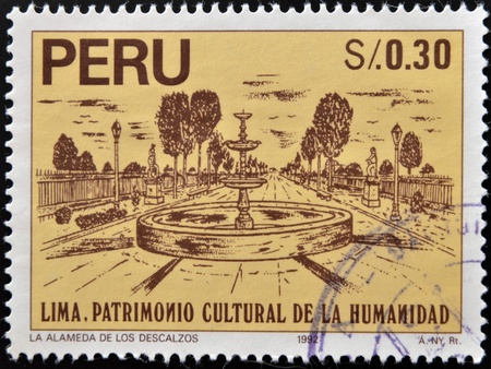 PERU - CIRCA 1992: A stamp printed in Peru dedicated to Lima humanity's cultural heritage, shows the bare Mall (La alamada de los descalzos), circa 1992の写真素材