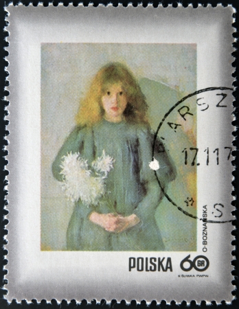 POLAND - CIRCA 1971: A stamp printed in Poland shows chrysanthemums young child by Olga Boznanska, circa 1971のeditorial素材
