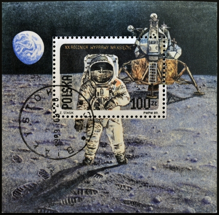 POLAND - CIRCA 1989: A stamp printed in Poland shows Neil Armstrong, lunar module "Eagle" from Apollo 11, circa 1989の写真素材