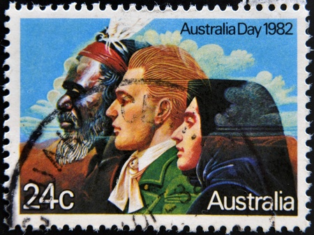 AUSTRALIA - CIRCA 1982: A stamp shows image of a Australian Aborigines and English messioner, circa 1982 のeditorial素材