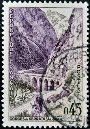 FRANCE - CIRCA 1959: A stamp printed in France shows image of the Kerrata Gorge, Algeria, circa 1959 の写真素材