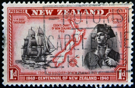 NEW ZEALAND - CIRCA 1940: stamp printed in New Zealand shows a portrait of Captain Cook, the H.M Bark Endeavour and maritime chart of the islands, circa 1940 のeditorial素材
