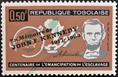 TOGO - CIRCA 1963: A stamp printed by Togo, shows Lincoln, Broken Fetters, Maps of Africa and US, emancipation from slavery, circa 1963 のeditorial素材