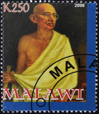MALAWI - CIRCA 2004: A stamp printed in Malawi shows Mohandas Karamchand Gandhi, circa 2004 のeditorial素材