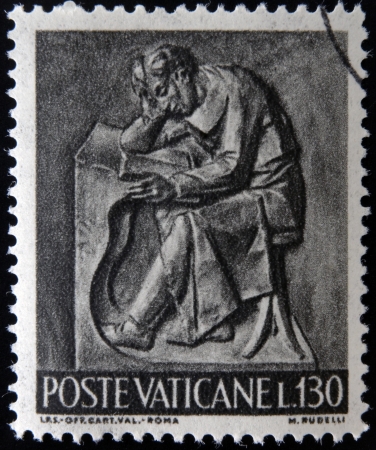VATICAN - CIRCA 1966: A stamp printed in Vatican shows Bas reliefs of arts and crafts, student, circa 1966 のeditorial素材