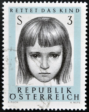 AUSTRIA - CIRCA 1966: a stamp printed in Austria shows Young, 10th anniversary of saving infant society, circa 1966のeditorial素材